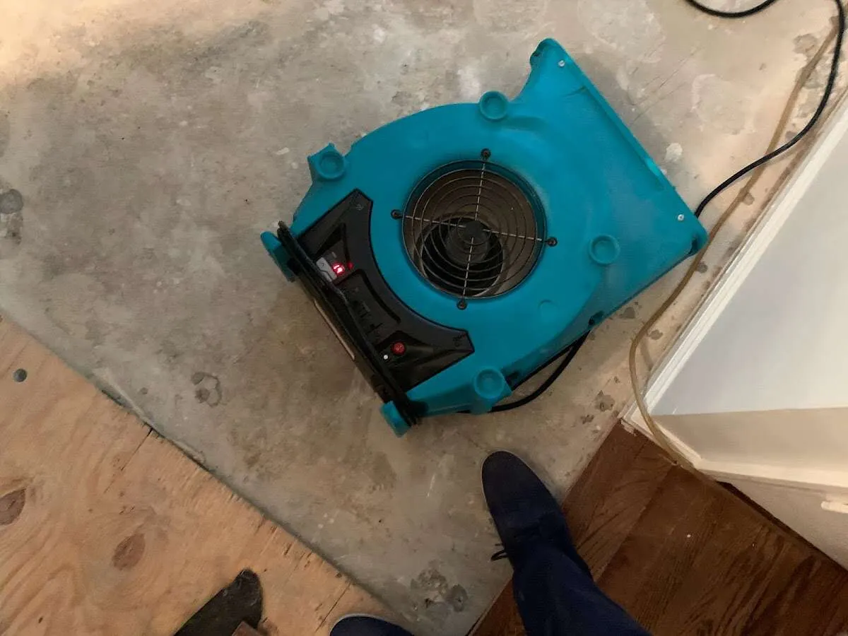 Air mover drying subfloor during Leak Detection & Repair in El Monte